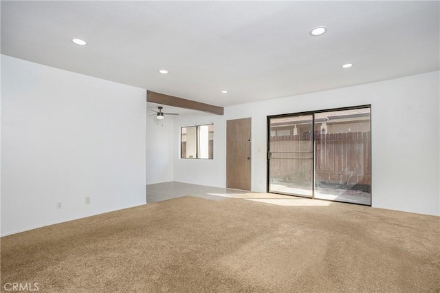 carpeted empty room with ceiling fan