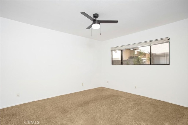 empty room featuring ceiling fan and carpet floors