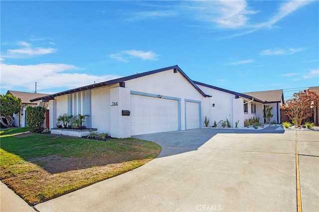 view of front facade with a garage and a front yard