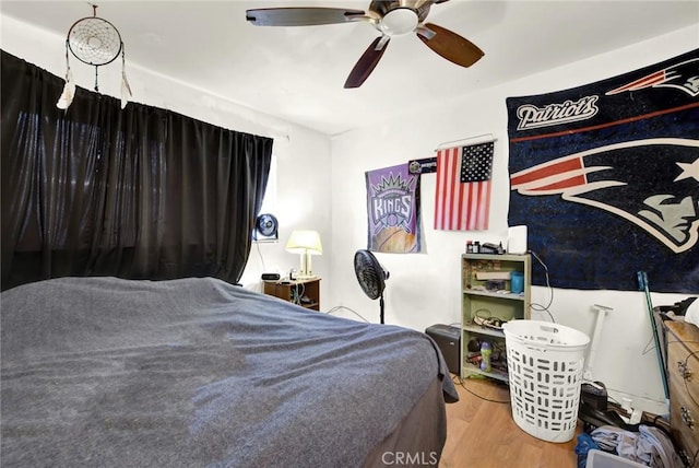 bedroom featuring ceiling fan and wood finished floors