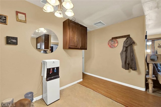 interior space with light hardwood / wood-style flooring and a chandelier