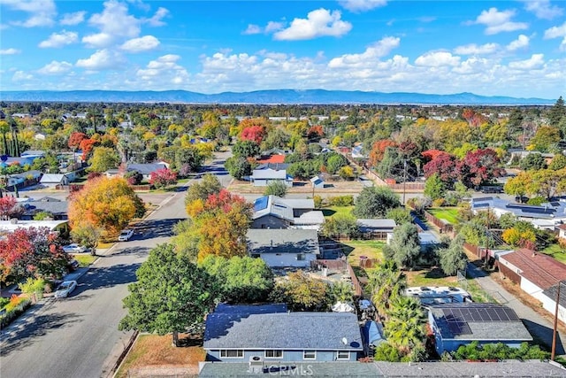 birds eye view of property with a residential view and a mountain view