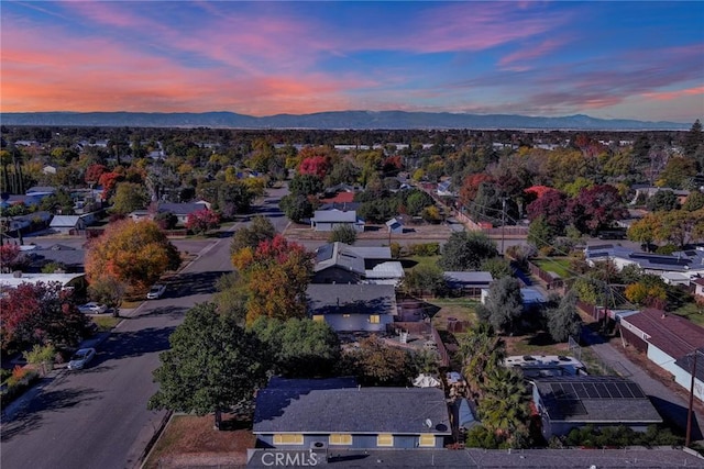 aerial view at dusk with a mountain view