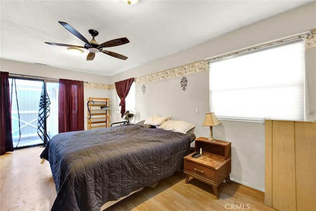 bedroom featuring access to outside, ceiling fan, and light hardwood / wood-style floors