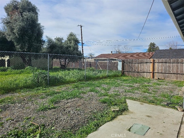 view of yard with fence