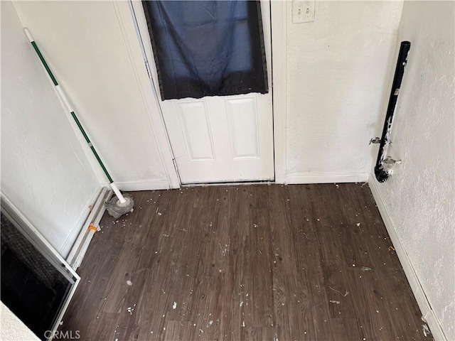 entryway with dark hardwood / wood-style flooring