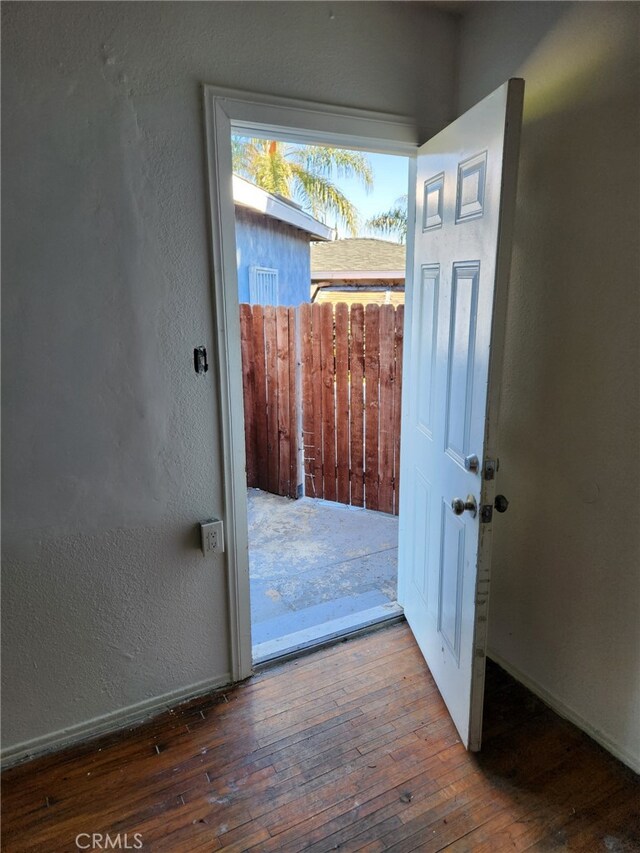 doorway to outside with hardwood / wood-style floors