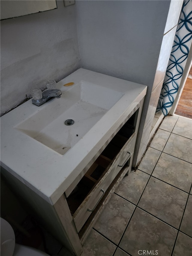 bathroom with tile patterned floors and sink