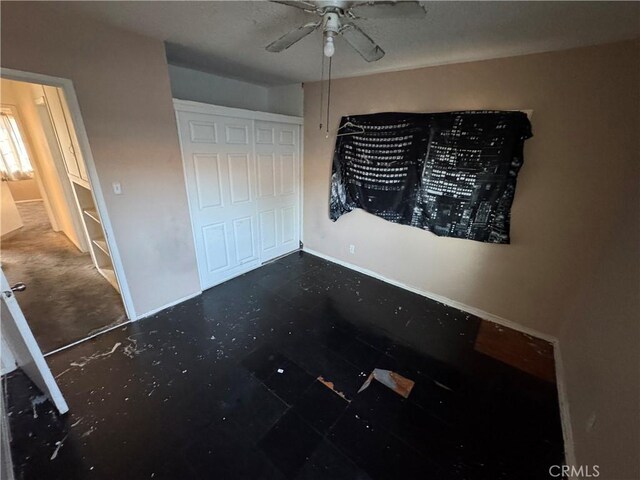 unfurnished bedroom with a closet and ceiling fan