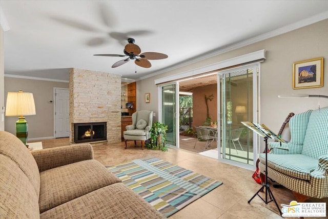 tiled living room featuring a stone fireplace, ceiling fan, and crown molding