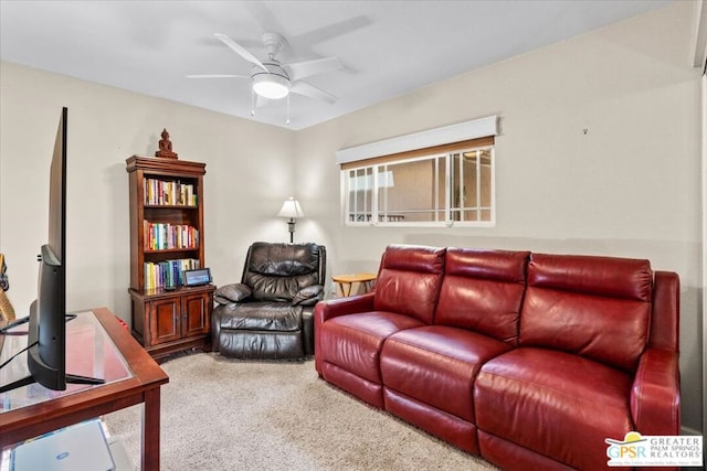 carpeted living room featuring ceiling fan