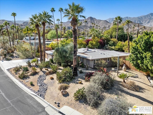 birds eye view of property featuring a mountain view