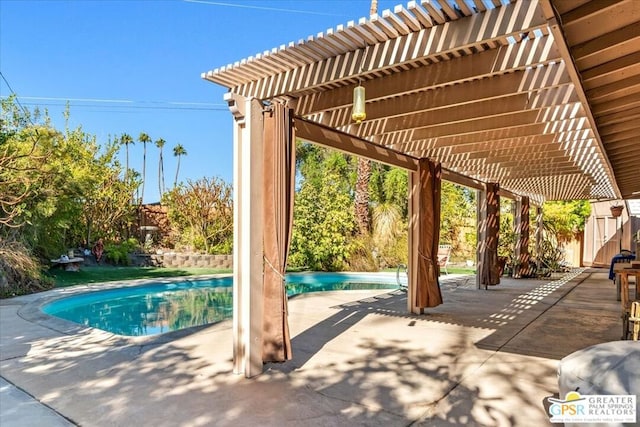 view of pool with a patio area and a pergola