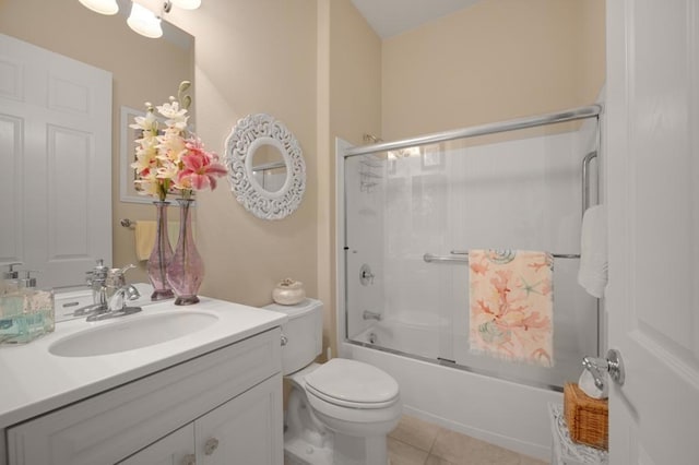 full bathroom featuring tile patterned flooring, vanity, toilet, and enclosed tub / shower combo