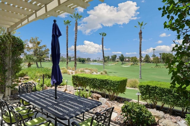 view of community with a pergola and a lawn