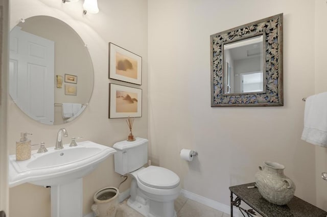 bathroom featuring tile patterned floors, sink, and toilet