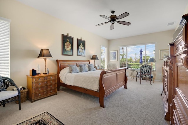 bedroom with light colored carpet and ceiling fan