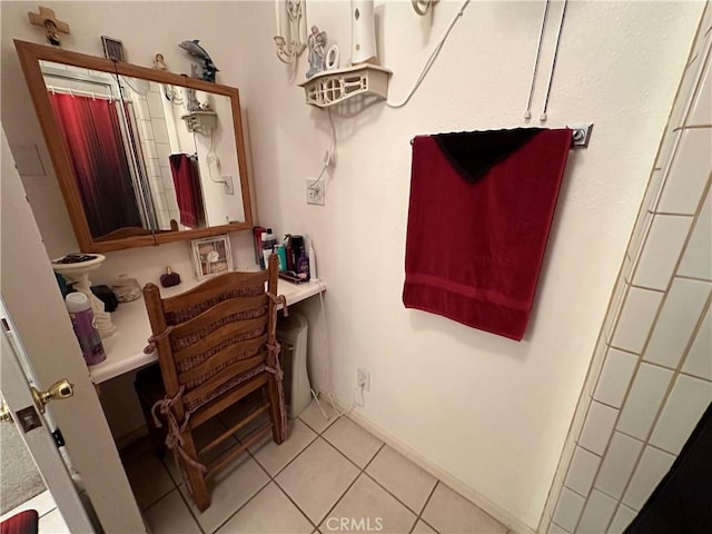 bathroom featuring tile patterned flooring and curtained shower