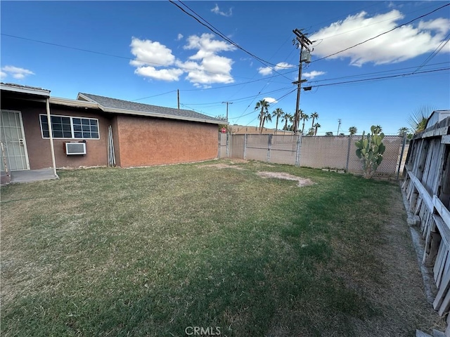 view of yard with a wall mounted air conditioner