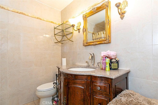 1748 N Kenmore Ave Unit 203, Los Angeles, CA 90027 - bathroom featuring tile walls, vanity, and toilet