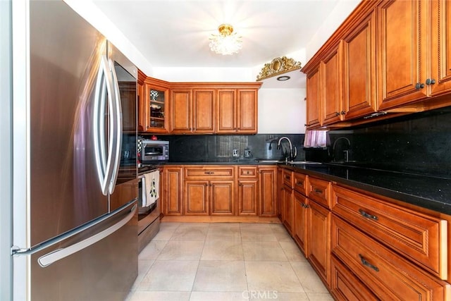 1748 N Kenmore Ave Unit 203, Los Angeles, CA 90027 - kitchen featuring smart refrigerator, brown cabinets, tasteful backsplash, and light tile patterned floors