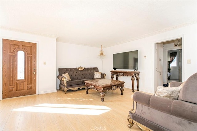 1748 N Kenmore Ave Unit 203, Los Angeles, CA 90027 - living area featuring wood finished floors, baseboards, and crown molding