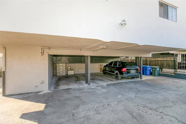 view of vehicle parking with a carport