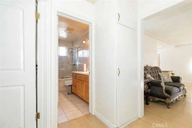 1748 N Kenmore Ave Unit 203, Los Angeles, CA 90027 - hallway featuring light wood finished floors