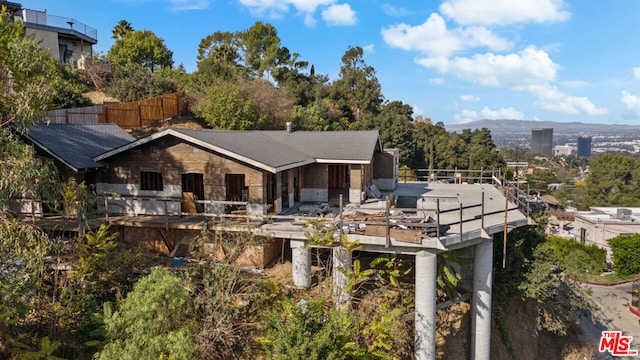 back of property with a balcony