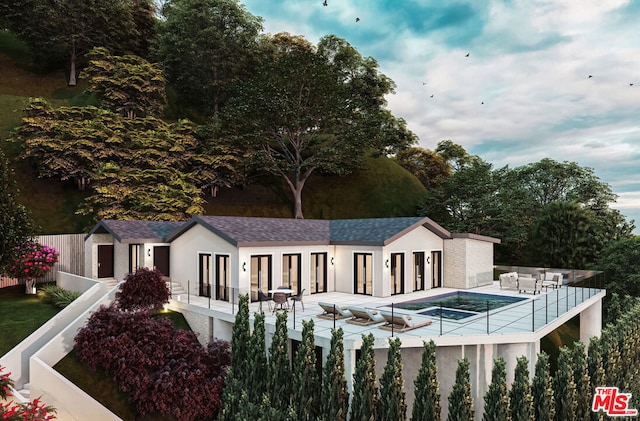 view of pool featuring french doors and a hot tub