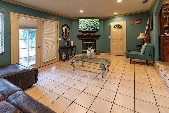 living room with crown molding and light tile patterned floors