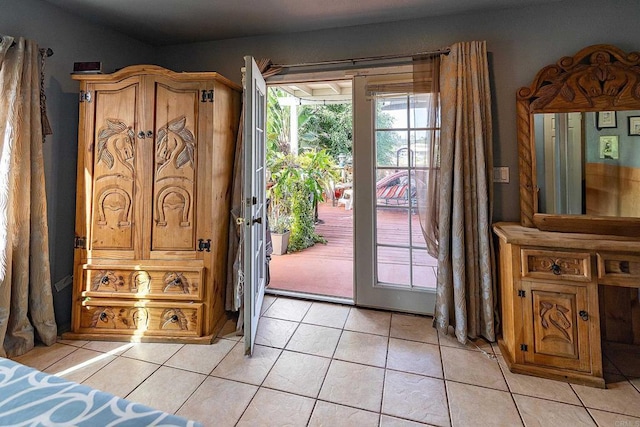 doorway featuring light tile patterned flooring