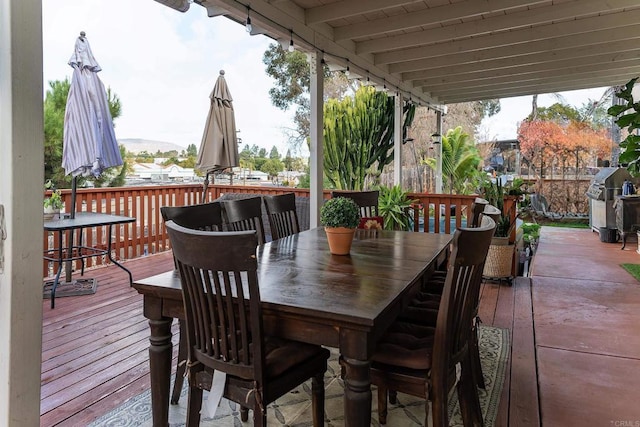 wooden terrace with area for grilling