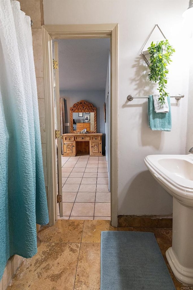 bathroom with tile patterned flooring