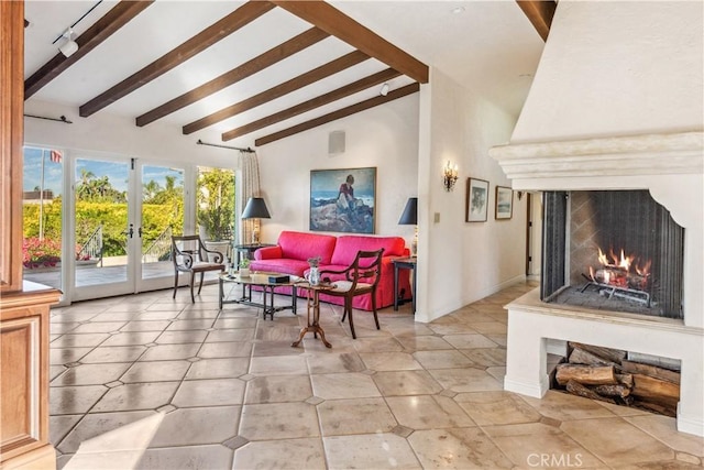 interior space featuring beam ceiling, a large fireplace, high vaulted ceiling, and french doors