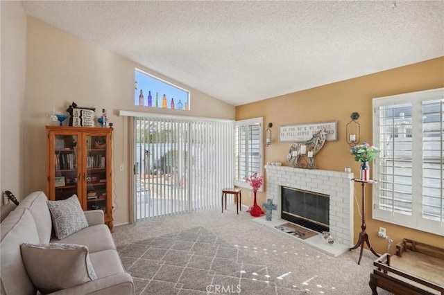 living room with carpet flooring, lofted ceiling, a textured ceiling, and a brick fireplace