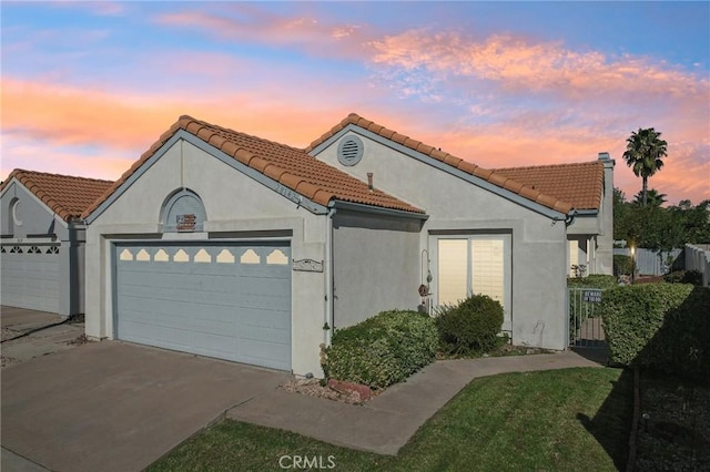 mediterranean / spanish house featuring a garage