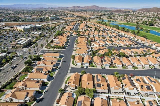 birds eye view of property featuring a mountain view