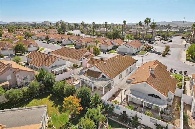 birds eye view of property with a mountain view