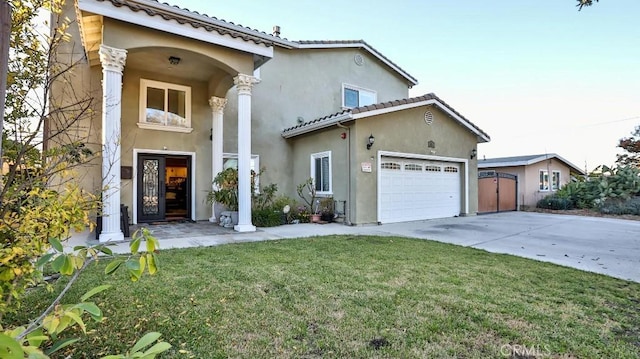 view of front of house featuring a front yard and a garage