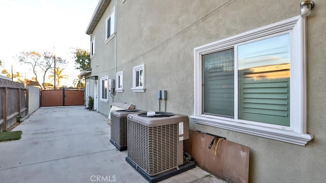 view of property exterior featuring a patio and central AC unit