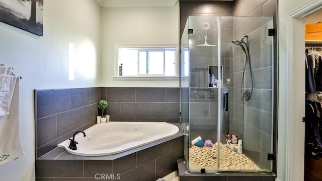 bathroom with shower with separate bathtub