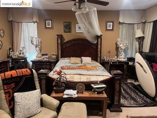 bedroom with carpet and ceiling fan