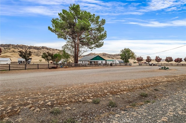 view of road featuring a rural view and a mountain view