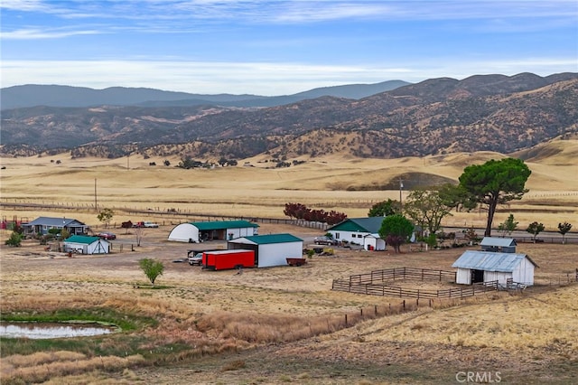 birds eye view of property with a rural view and a mountain view