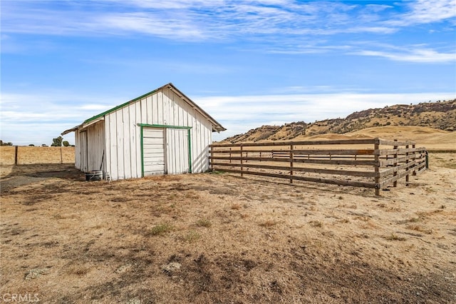 view of outbuilding with a rural view