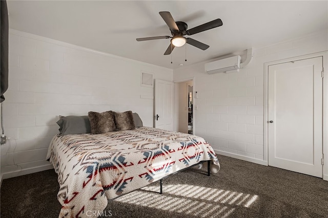 bedroom with ceiling fan, a wall mounted AC, and dark colored carpet