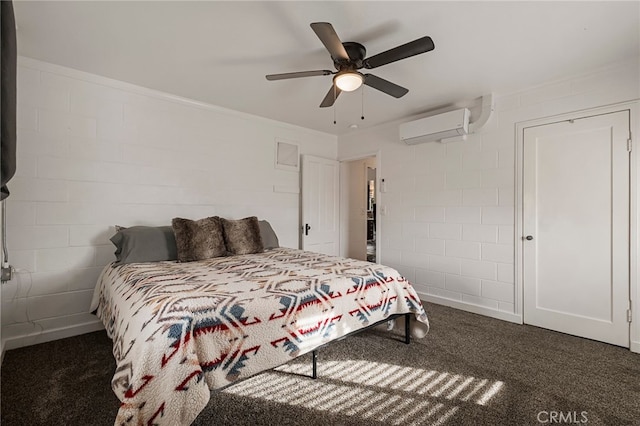 carpeted bedroom with a wall unit AC, concrete block wall, and ceiling fan