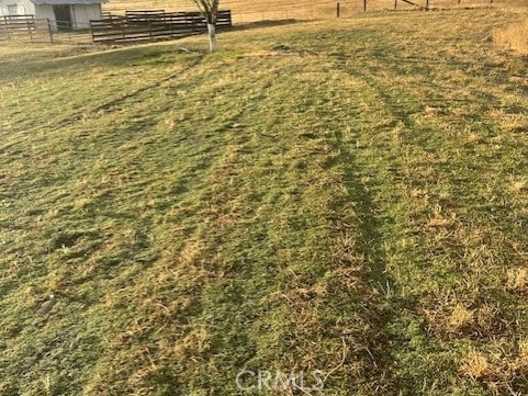 view of yard with a rural view