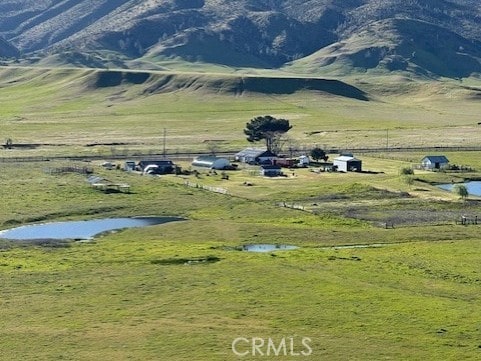 mountain view with a rural view and a water view